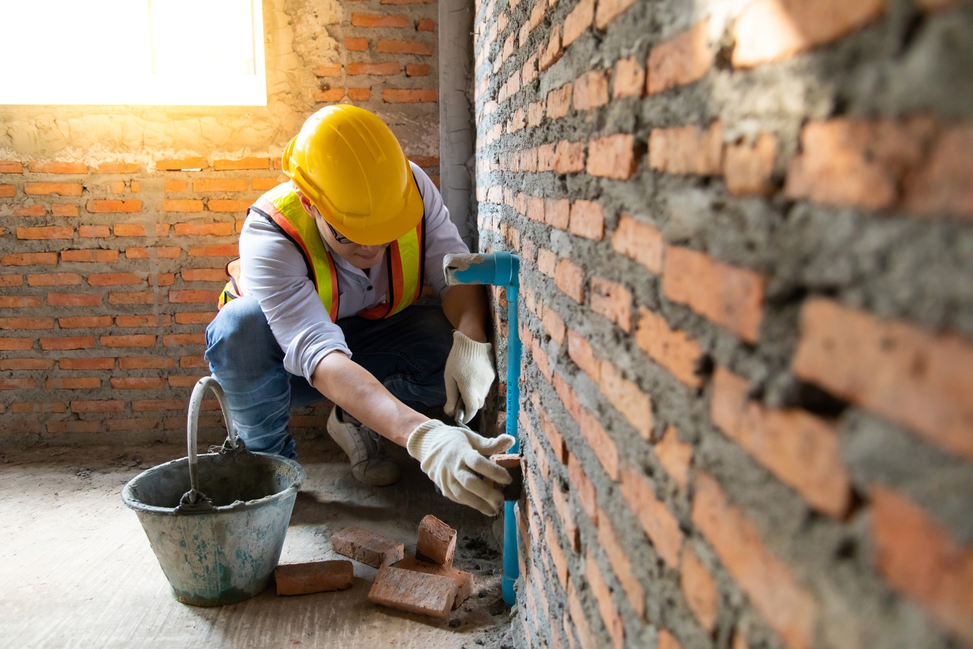 bricklayer at work on a construction site